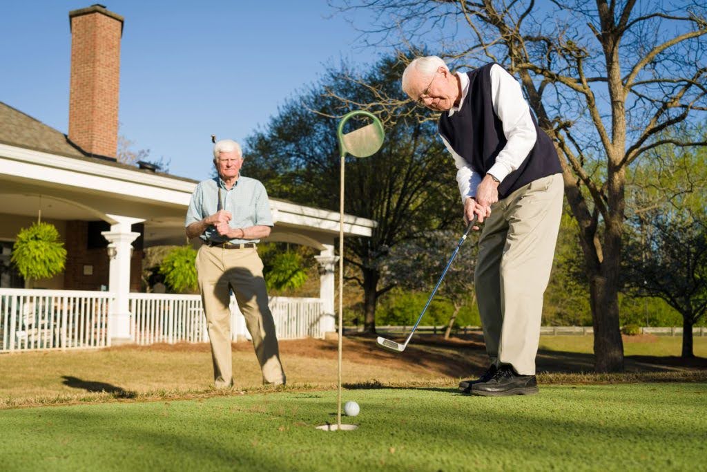 Senior men playing golf